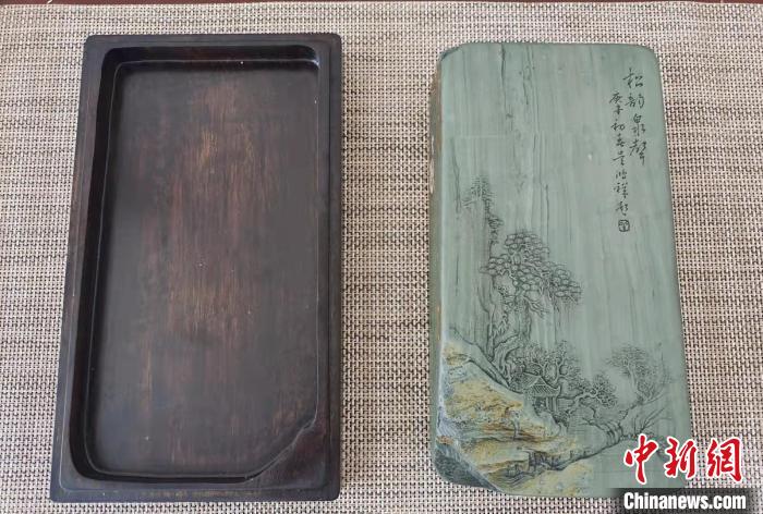 圖為盧保勝為提升洮硯文化內涵，制作“一硯一銘、一盒一拓”成品展示?！堟?攝